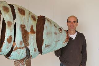 mike chaikin with his giant potato cod -one man show at Kestle Barton the fish is 3m long and 1m high
